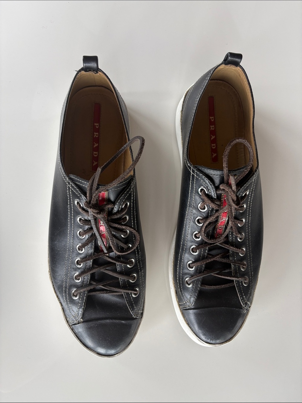 Prada Black Leather Men’s Lace-Up Sneakers with Red Logo Detail